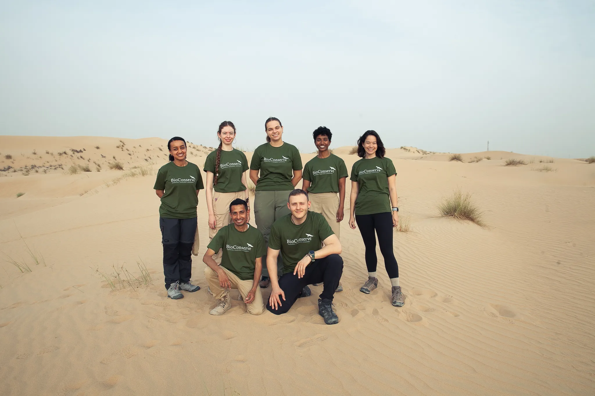 The BioConserve team on a desert dune